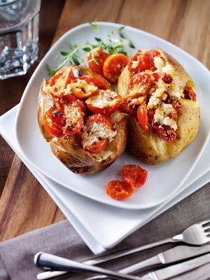 A plate of food on a table, with Tomato and Potato