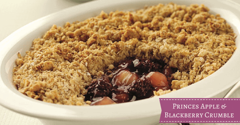 A box filled with different types of food on a plate, with Apple and Blackberry