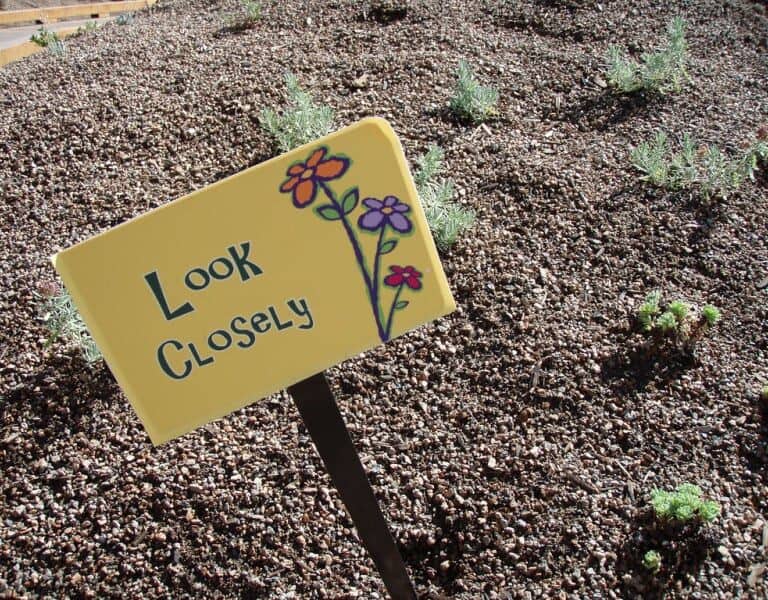A sign sitting on the ground