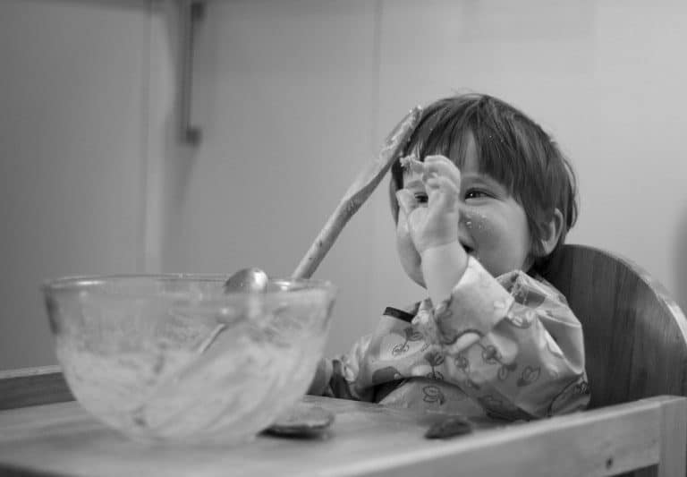 A person drinking from a bowl, with Cake and Chocolate