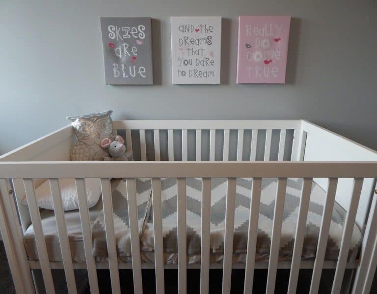 A bedroom with a bed and a chair