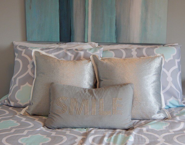 A bed with a blue blanket