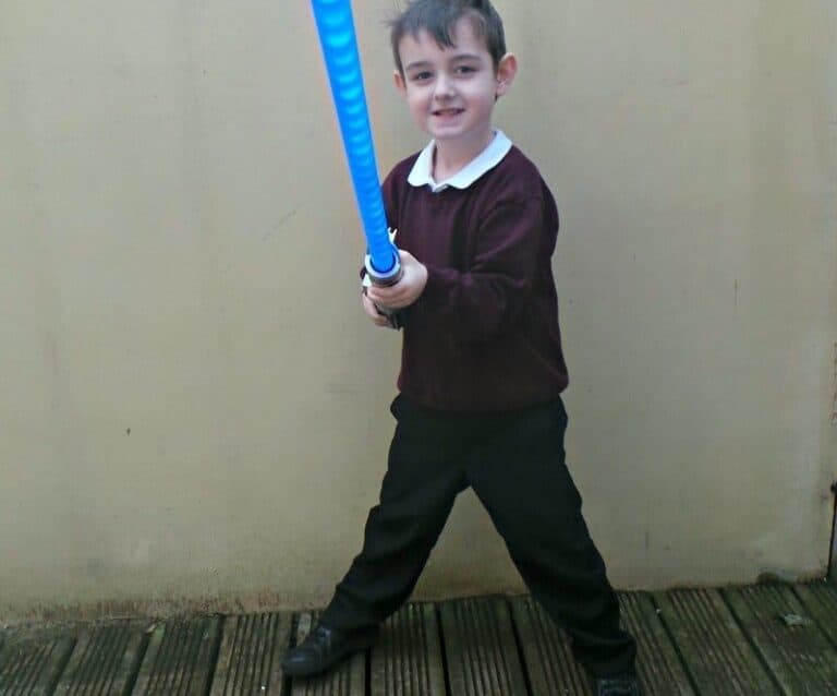 A young boy holding a baseball bat