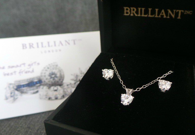 A laptop computer sitting on top of a book