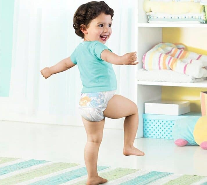 A young girl sitting on a bed