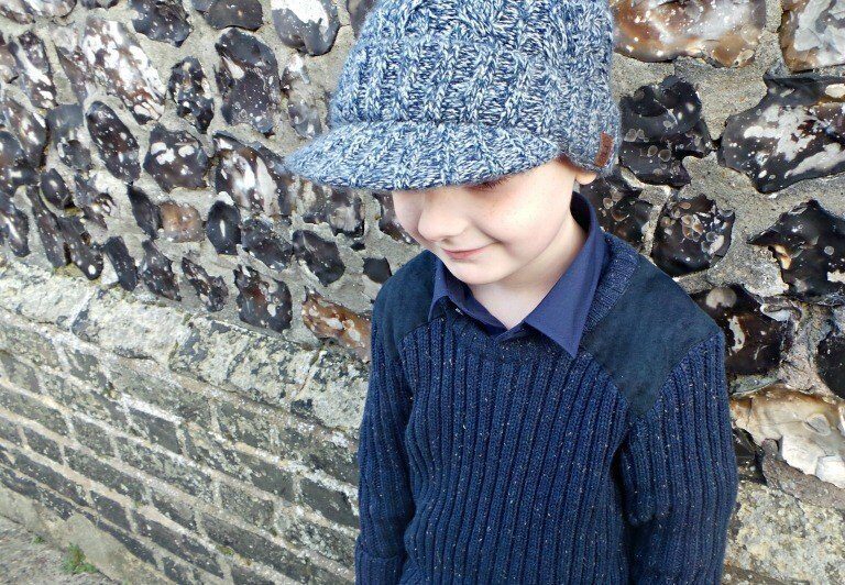 A young boy wearing a hat