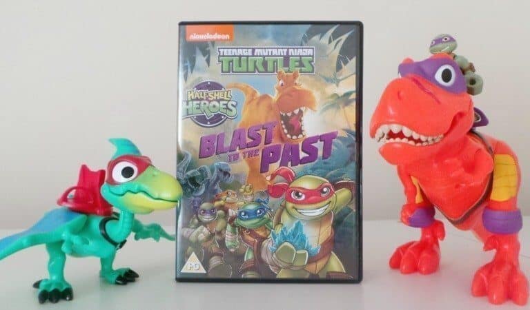 A teddy bear sitting on top of a stuffed toy