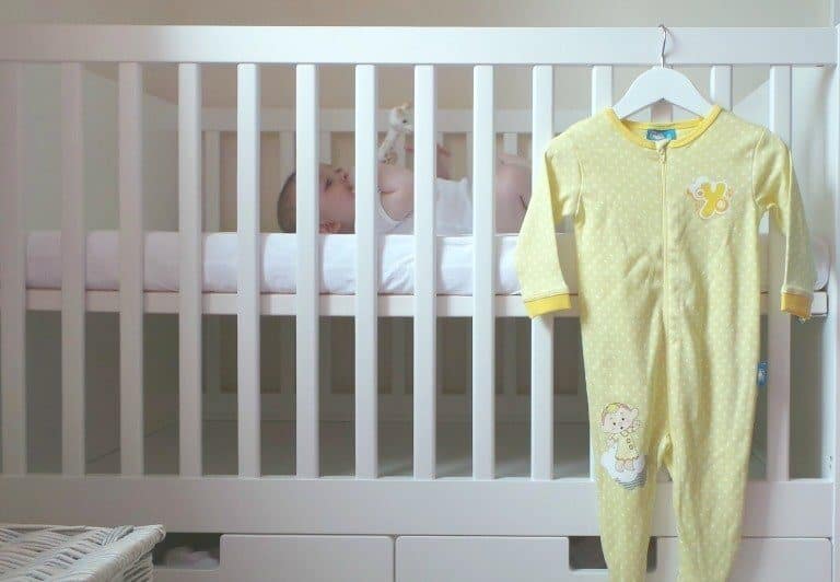 A person standing on top of a bed