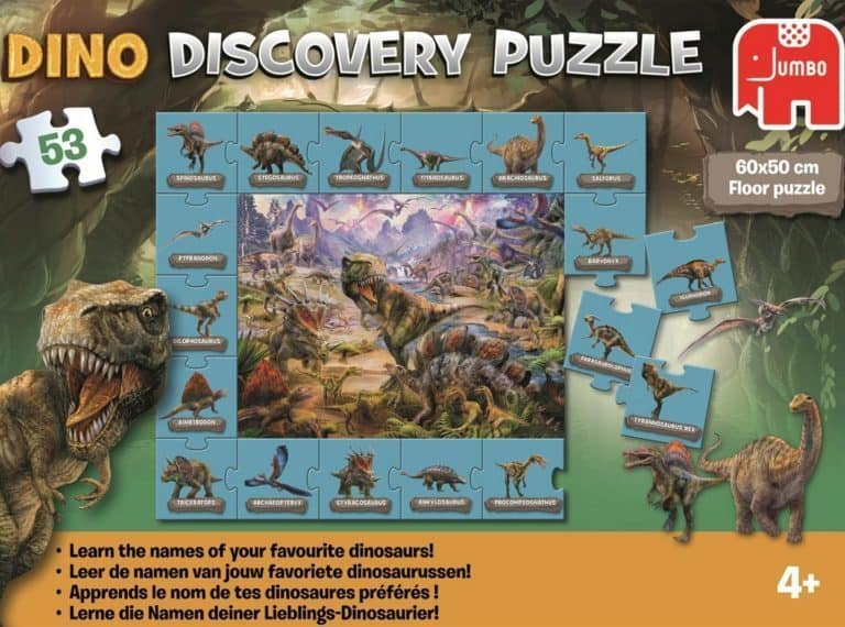 A cat lying on top of a sign