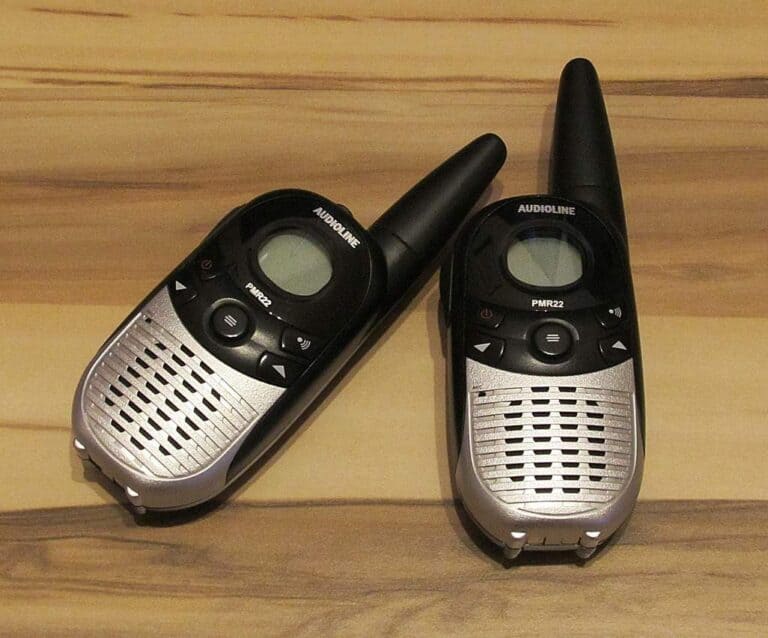 A cellphone lying on top of a wooden table