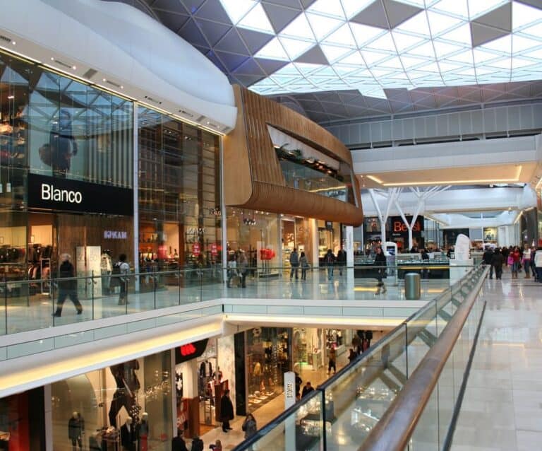 A group of people sitting at a train station