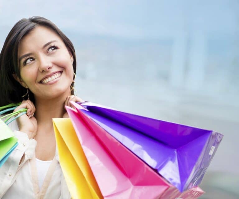 A woman holding a colorful umbrella