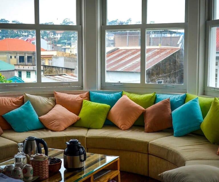 A living room filled with furniture and a large window