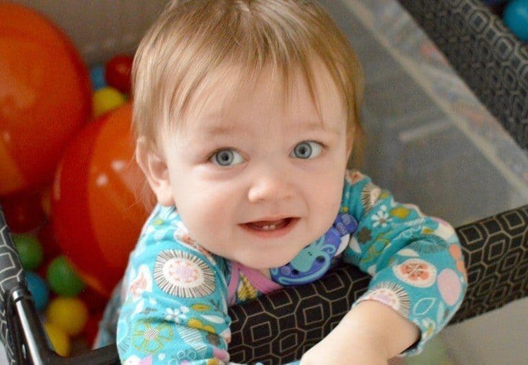 A small child sitting on a table