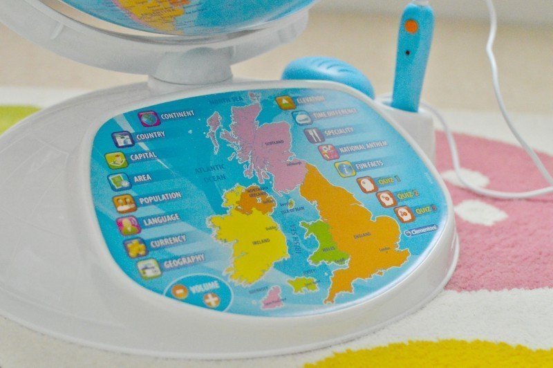 A plate of birthday cake on a table, with Globe and Tigger