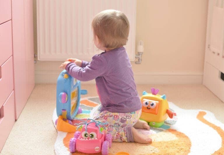 A little girl sitting on a table