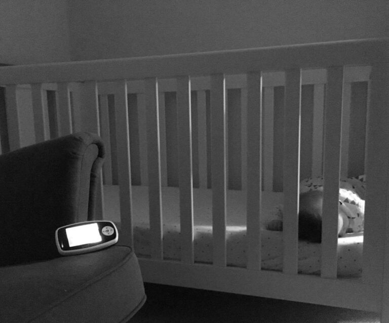 A bedroom with a large mirror