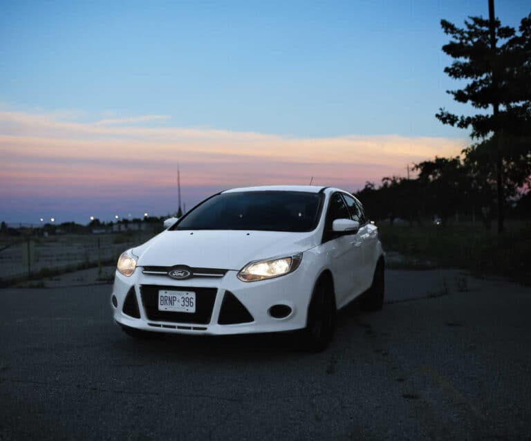 A car parked on the side of a road
