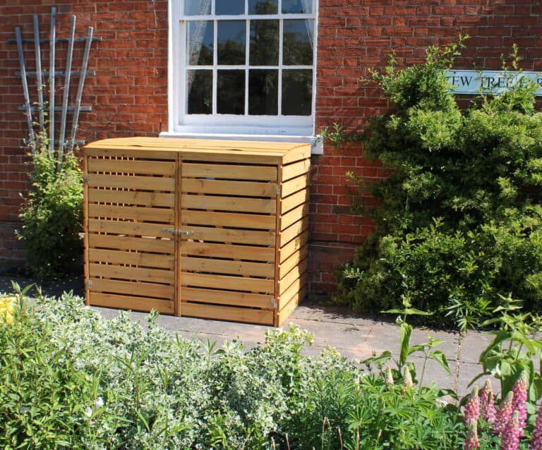 A garden in front of a brick building