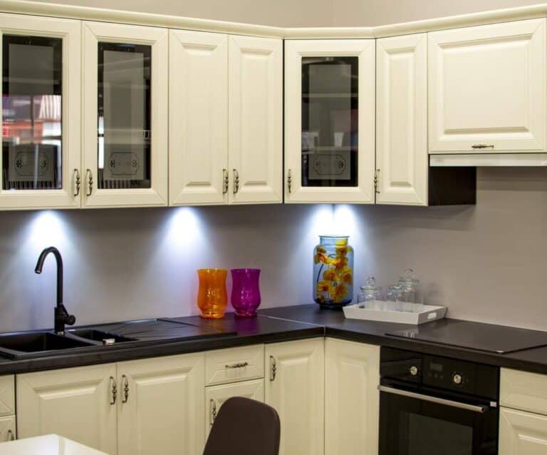 A kitchen with a sink and a microwave