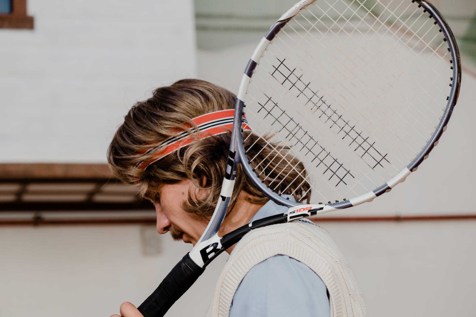 a man with a tennis racket