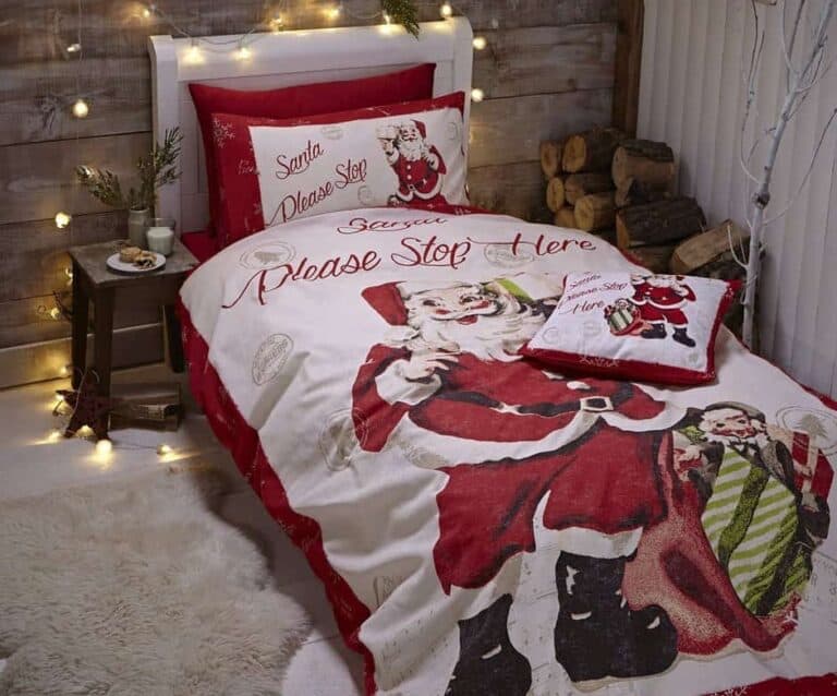 A bed with a pink blanket