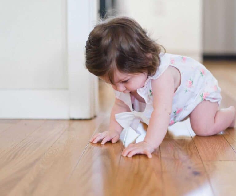 A small child sitting on the floor