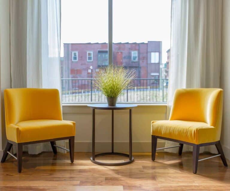 A dining room table in front of a window