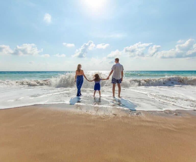 A child standing on a beach