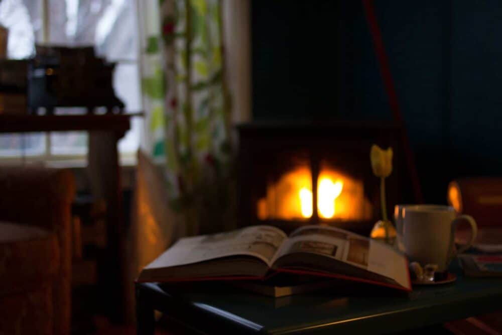 Easy Ways to Reduce Your Heating Bills - A fire place sitting in a room