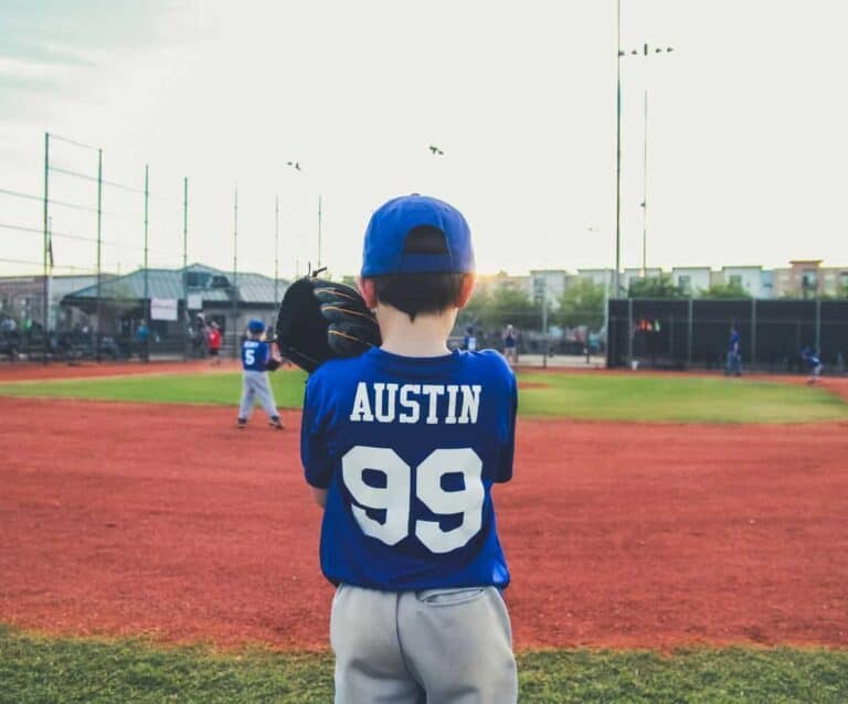 A young boy holding a baseball bat on a field