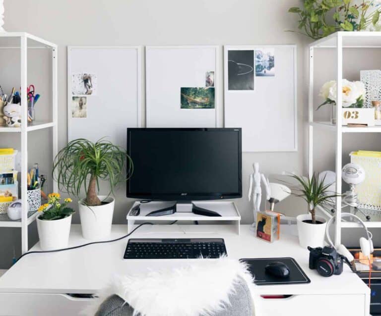 A desk with a computer on a table