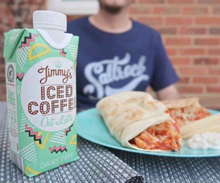 A person sitting at a table with a plate of food, with Coffee