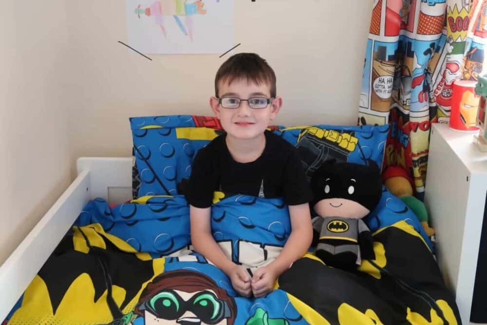 Adding the finishing touches to a Batman Inspired Bedroom