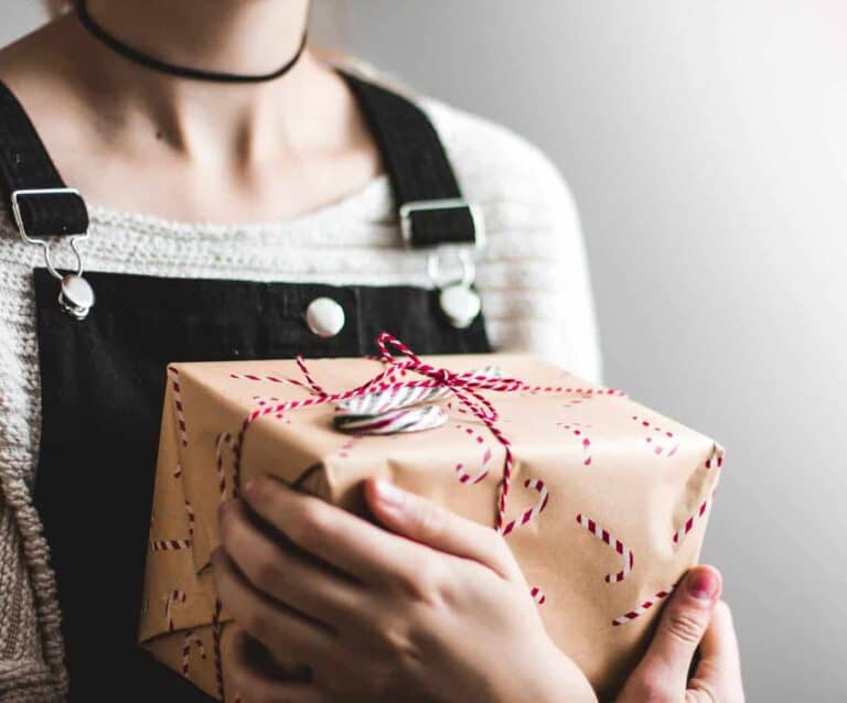 A person holding a cake