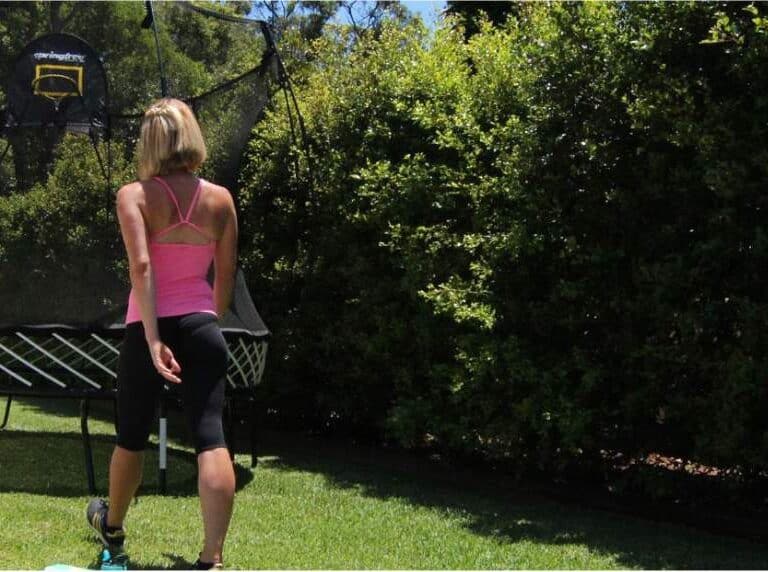 A woman sitting on a bench in a park