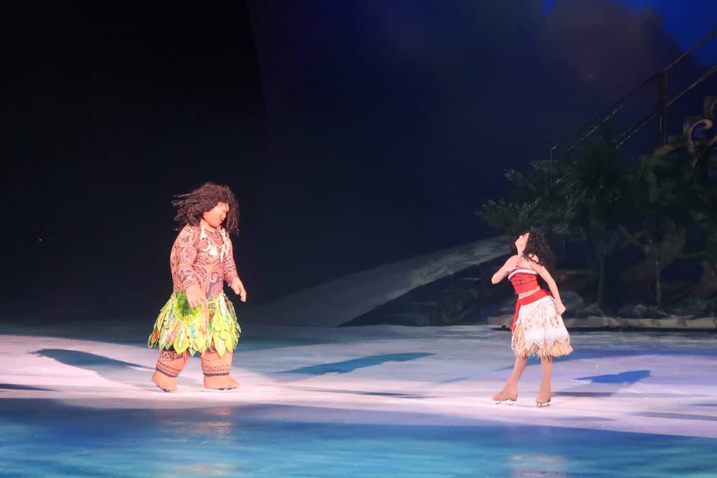 A little girl throwing a frisbee in the water