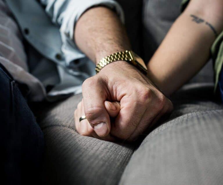 A close up of a person sitting on a couch