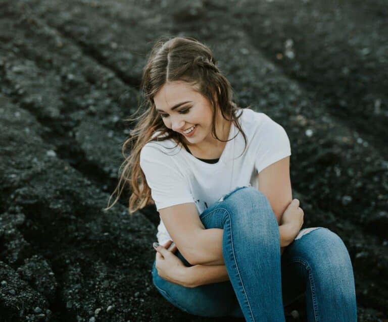 A girl sitting on a bench