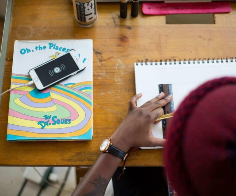 A person sitting on a wooden table