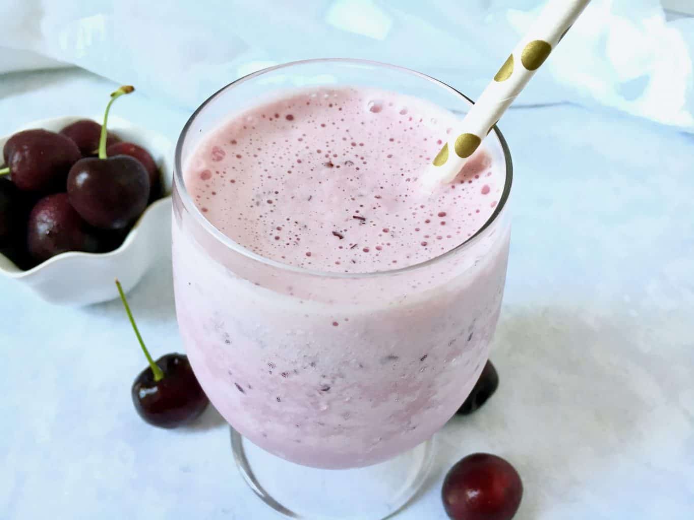 A cup of coffee on a table, with Smoothie and Peach