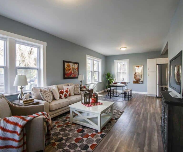 A living room filled with furniture and a large window