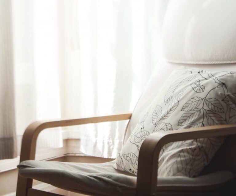 A large bed sitting in a chair