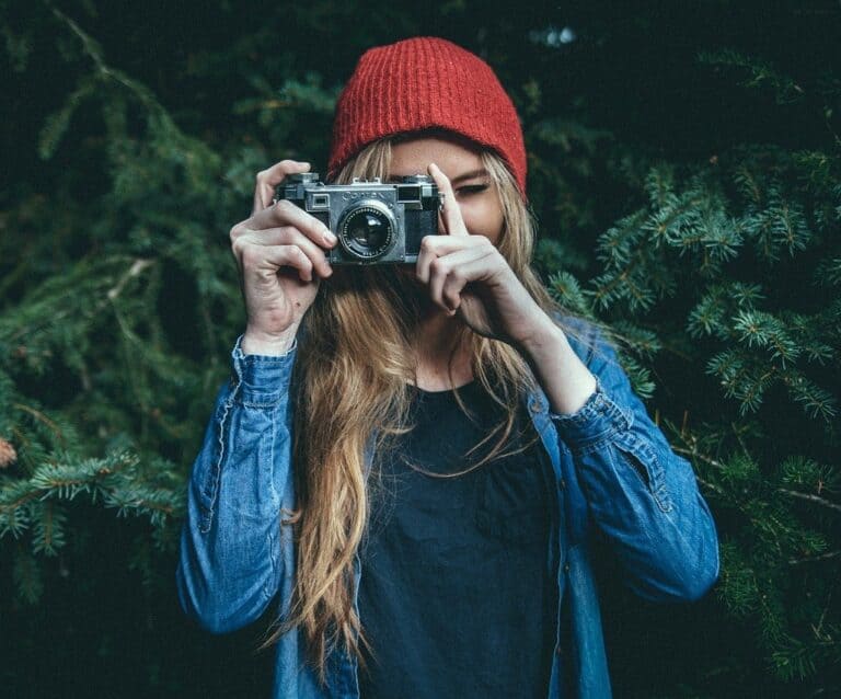 A person wearing a hat talking on a cell phone