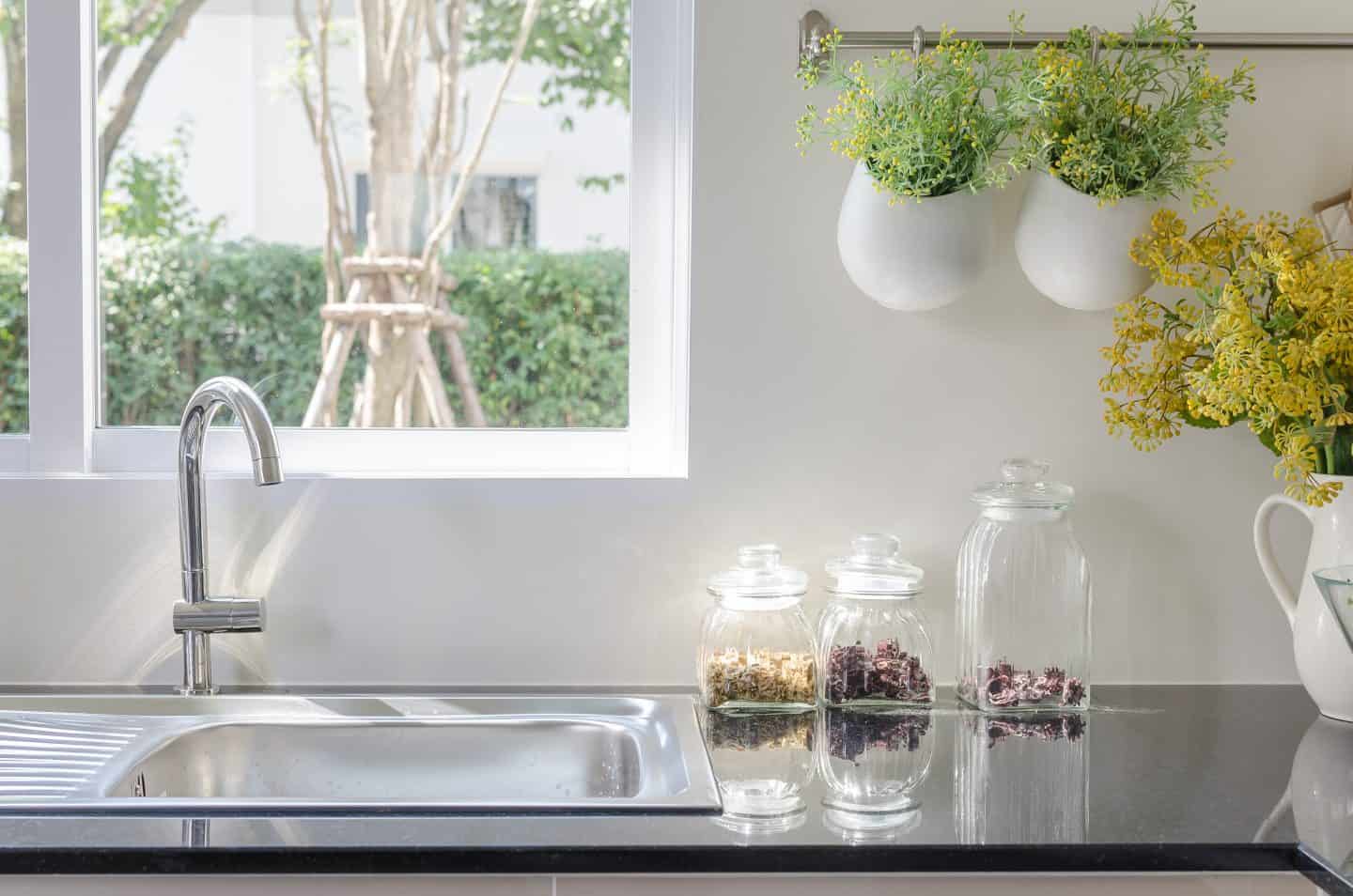 A vase of flowers on a kitchen counter