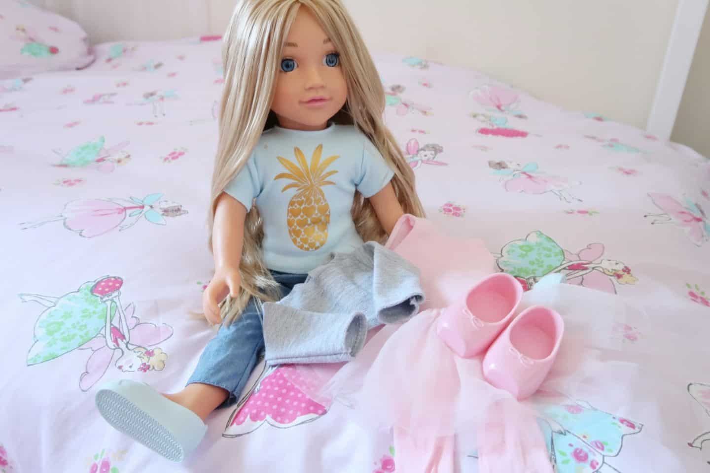 A little girl sitting on a bed