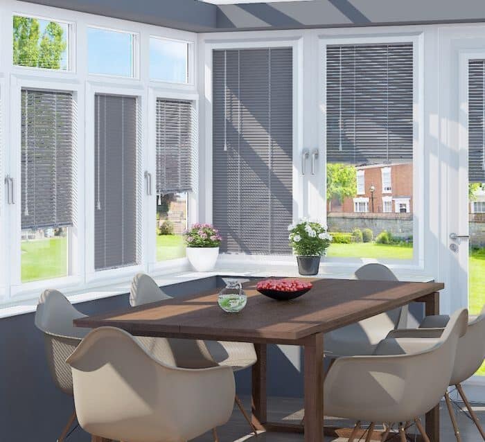 A dining room table in front of a window