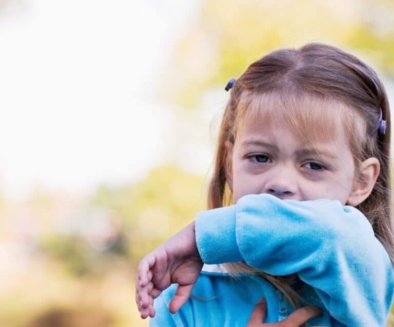 A little girl in a blue shirt