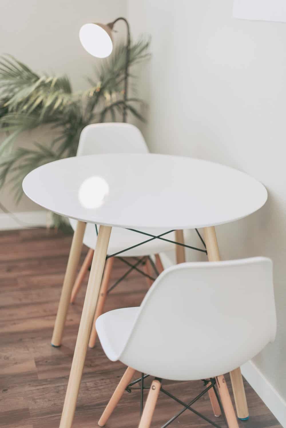 A chair sitting in front of a wooden table