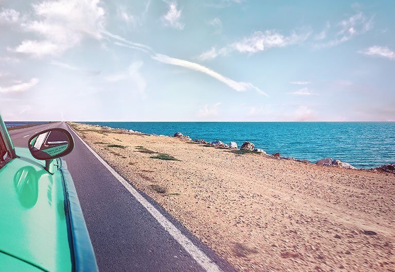 A sandy beach next to the ocean